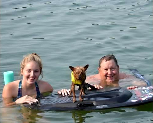 Bob swimming with his daughter