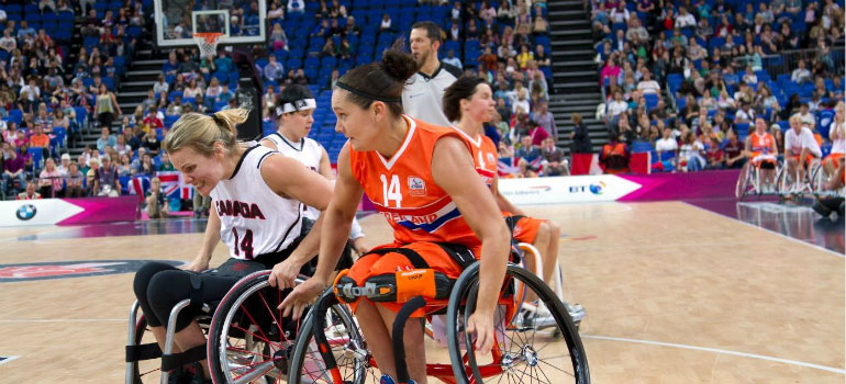 Women playing wheelchair basketball