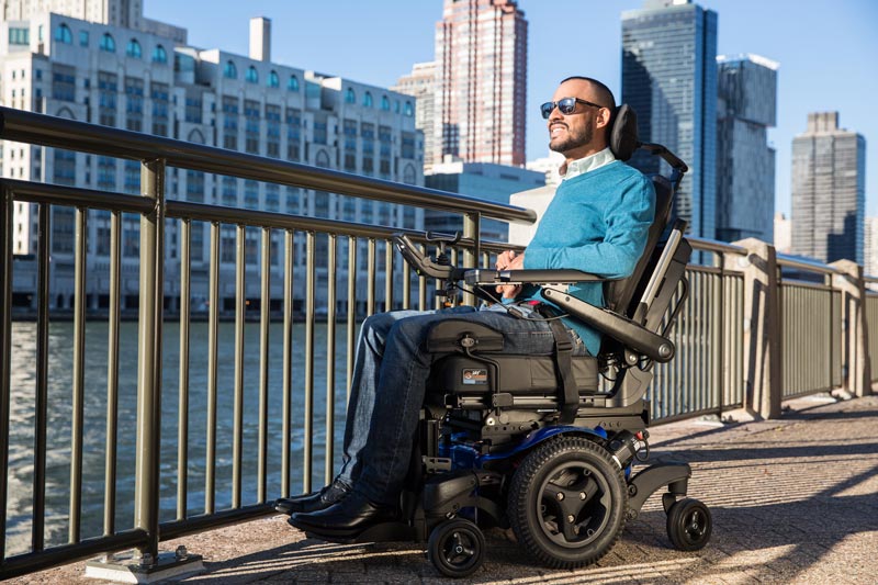 A man using a power wheelchair taking in the view