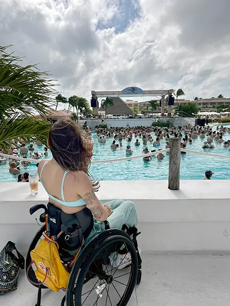 Eden attending a music festival in her wheelchair