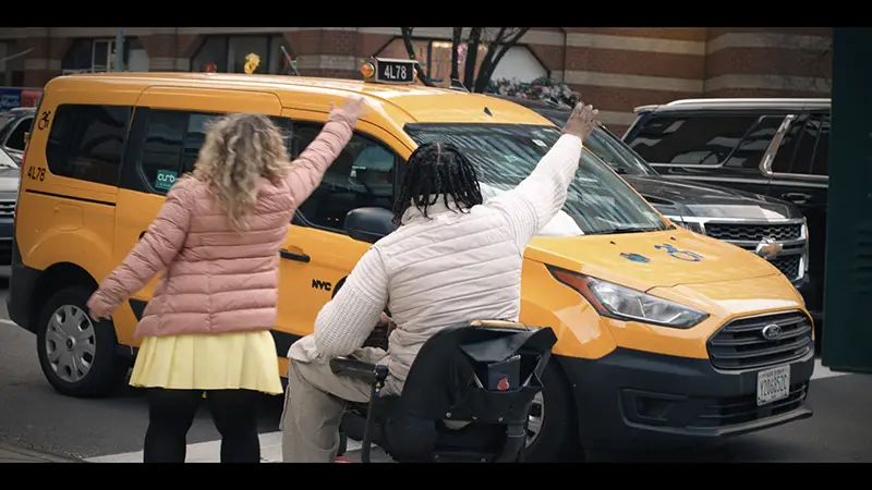 Film still, trying to hail a cab